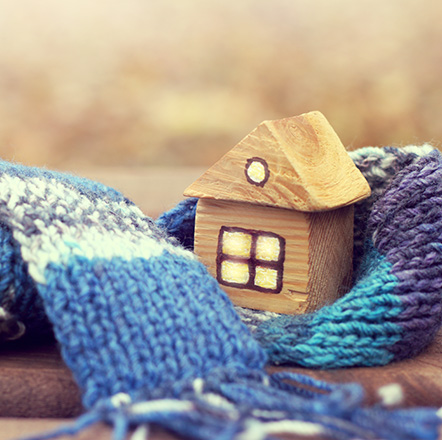 House wrapped in a scarf to show warmth and safety