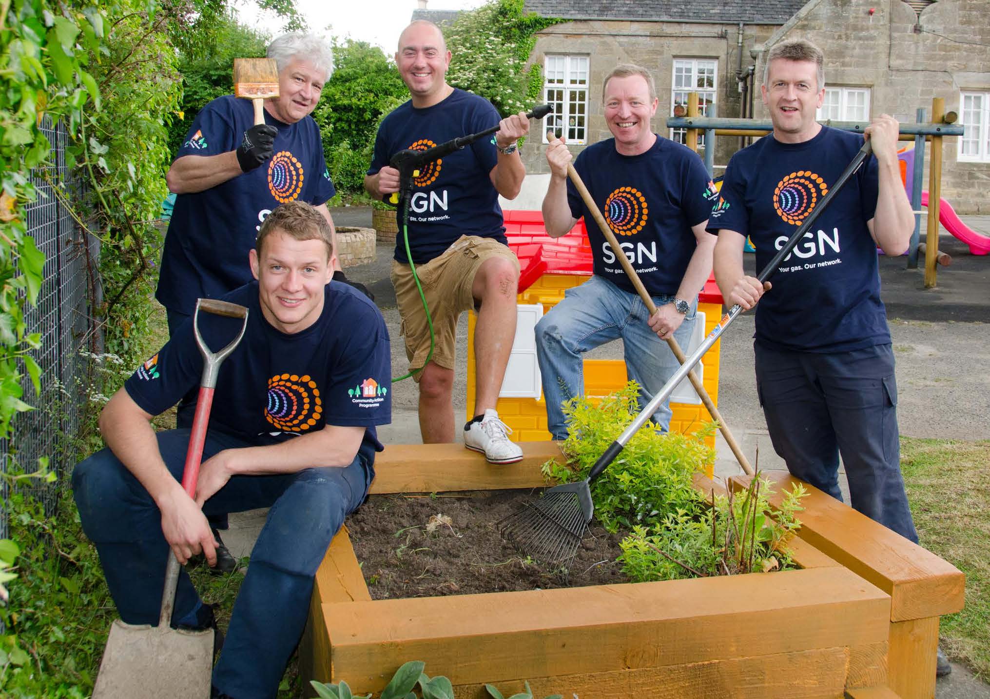 SGN employees working on a community gardening project