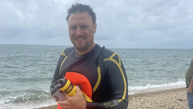 Our Regional Manager Jon Karp in a wetsuit after swimming the Solent