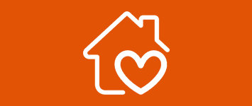 white icon showing a house with a heart in one corner on an orange background