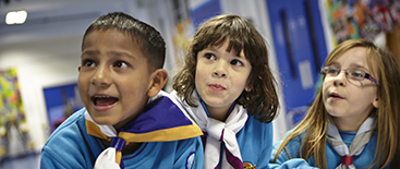 image showing one boy and two girls dressed in blue beavers uniforms