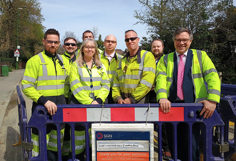 SGN engineers and MP Jeremy Quin join staff from West Sussex County Council at the site of gas network upgrade work in Worthing Road, Horsham