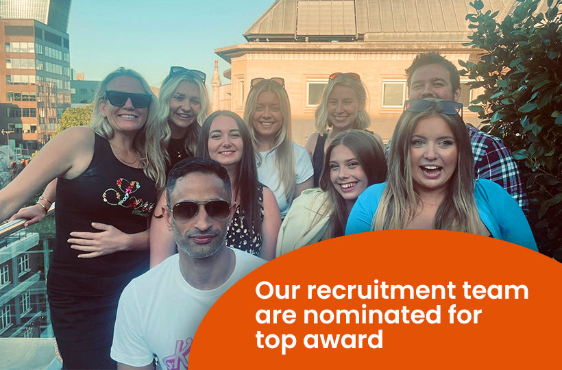 A happy group of nine people on a rooftop in the sunshine. Text: Our recruitment team are nominated for a top award