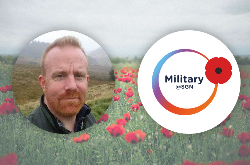 A photo of a man against a backdrop of a field of poppies