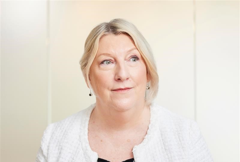 Head and shoulders image of Penny Meddes, Chief People Officer at SGN. She wears business attire and is looking into the distance.