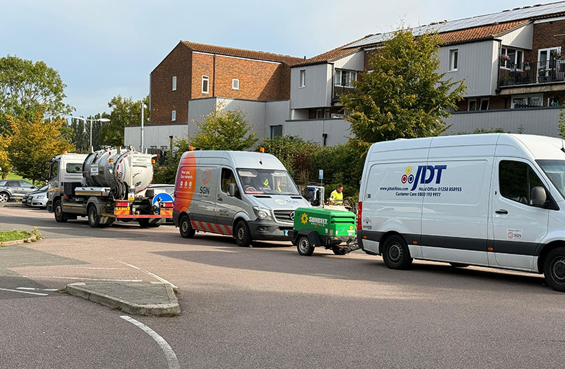 Two SGN vehicles and a contractor van parked in a street, as part of our response to a loss of gas supply incident in Aylesbury, Bucks