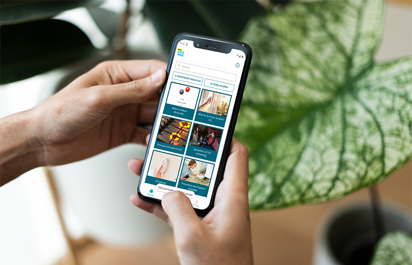 Two hands operating the Think CO app on a mobile phone