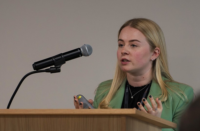 Head and shoulders of Anna Morris addressing the audience at  one of the speakers at SGN's Innovation Showcase event