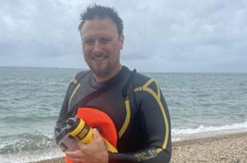 Our Regional Manager Jon Karp in a wetsuit after swimming the Solent