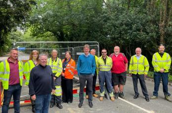 MP Greg Clark (centre) standing with operational teams next to the work area along Pembury Road in Tunbridge Wells