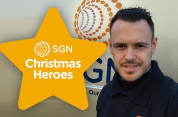 A smiling man in front of his SGN van