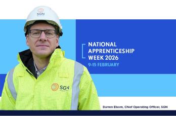 Head and shoulders image of Darren Elsom, COO of SGN. He wears protective clothing and is pictured alongside a logo for National Apprenticeship Week